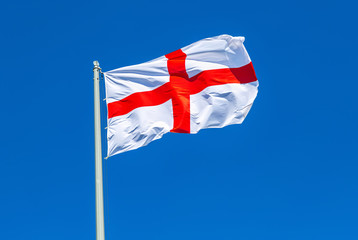 Flag of England waving in the wind against the sky
