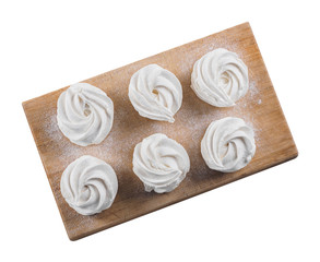 White homemade zephyr on the wooden board