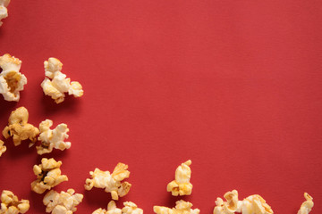 Popcorn on a red background, Top view with free space