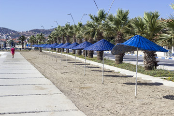Perspective  shot of blue sun shading on the coastline at summertime