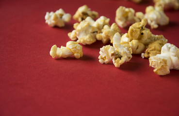 Caramel popcorn on a red surface