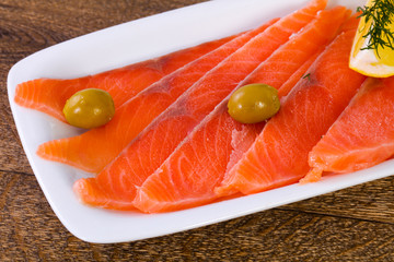 Sliced salmon with lemon