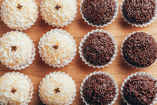 Handmade brazilian sweets: Beijinho and Brigadeiro. Common in children birthday party. Macro, close up
