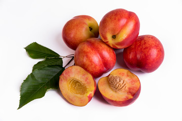 Fresh peaches, nectarines isolated on a white background