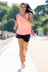 Fototapeta premium young attractive happy runner working out in a city party in fitness concept
