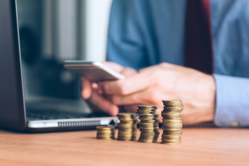 Coin stacker, businessman with stacked money