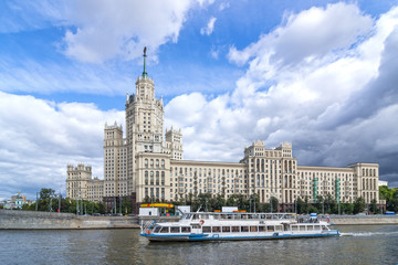 Moscow River. Pleasure boat. View ofa house on Kotelnicheskaya Embankment