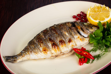 Grilled dorada served lemon