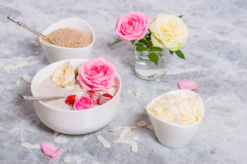 Fototapeta na wymiar Chia Seeds Pudding With Coconut. Rose Flowers.