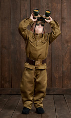 children are dressed as soldier in retro military uniforms