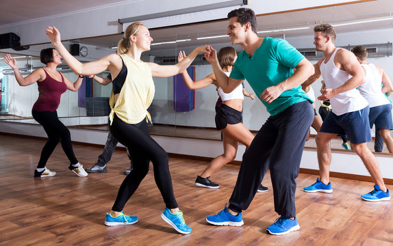 People Learning Swing At Dance Class