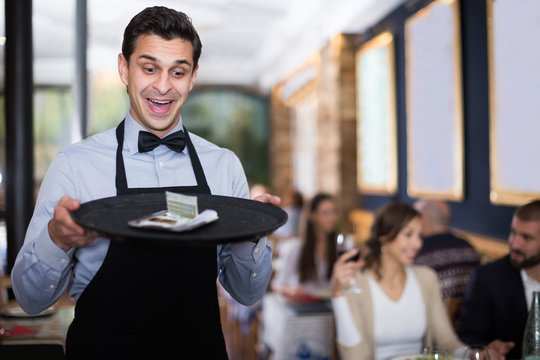  waiter man holding serving tray