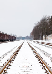 Fototapeta na wymiar The view along a snow covered railway track in Sigulda, Latvia.