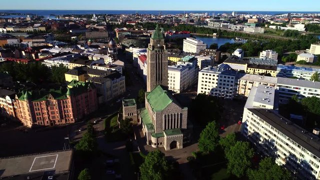 Helsinki church, UHD aerial tracking view around the kallio cathedral, on a sunny summer morning dawn, in Helsingfors, Uusimaa, Finland