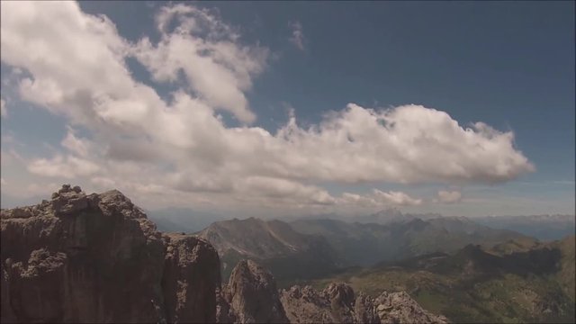 Time lapse (static) of clouds moving upon a mountain wilderness environment