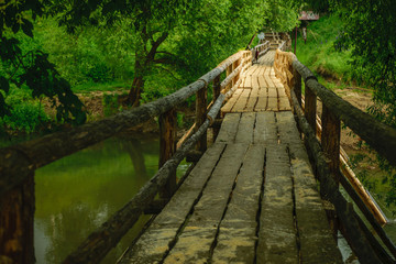 Obraz premium New wooden bridge across river in Russia