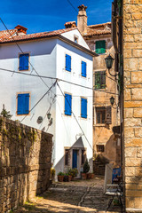 Fototapeta na wymiar Ancient colorful houses on a stone street in Groznjan village, Istria, Croatia, Europe.