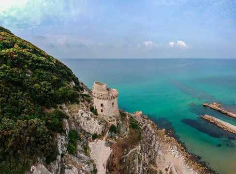Panoramic landscape with ancient tower in Sabaudia, Lazio, Italy. Scenic resort town village with nice sand beach and clear blue water. Famous tourist destination in Riviera de Ulisse