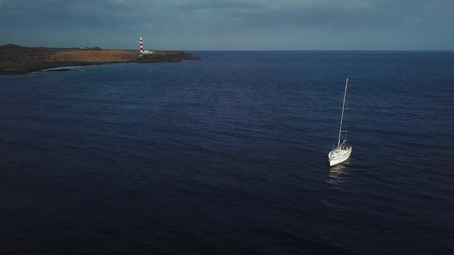 View from the height of the yacht near the lighthouse off the coast of Tenerife, Canary Islands, Spain