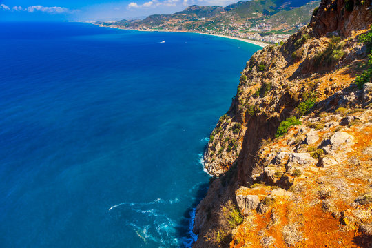 Beautiful sea panorama landscape of Alanya Castle in Antalya district, Turkey, Asia. Famous tourist destination with high mountains. Summer bright day and sea shore