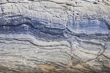The background is a natural plate made of white with blue, yellow and purple veins of Karar marble. The background is a natural plate Karar marble
