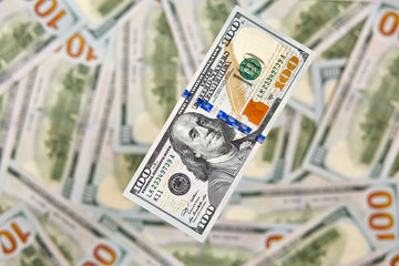 Wallpaper background American money hundred dollar bill view from above. Many US 100 banknote.