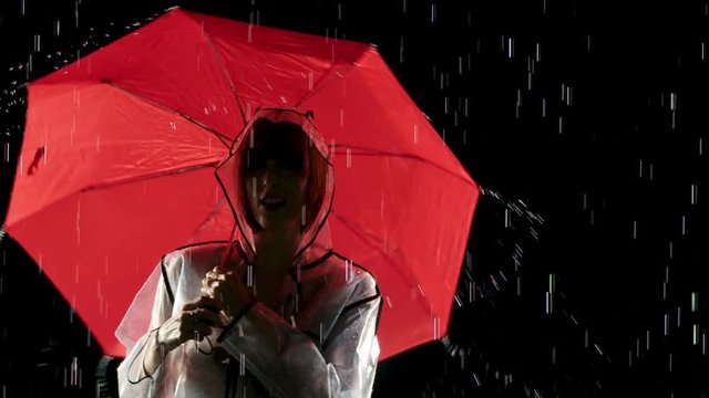 Beautiful woman dancing in the rain. Slow Motion.