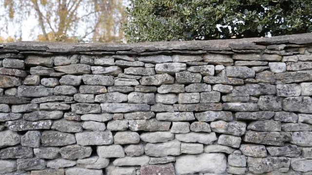 Traditional dry stone wall clad in England
