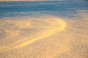 Clean snowy surface in a frosty day.