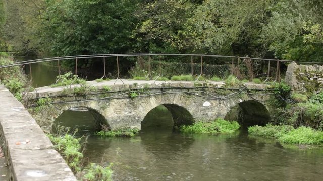 Little stone bridge across the stream in England