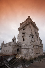 Fototapeta premium belem tower portugal medieval building perspective red sky