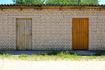 old bricks building with wood doors in country