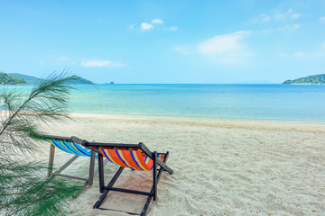 Obraz na płótnie Canvas Beach chairs on the white sand beach and tropical sea in Thailand.