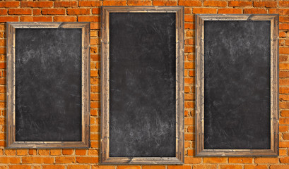Chalkboards on brick wall