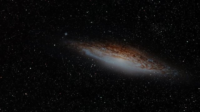 UFO galaxy rotating in outer space name NGC 2683, animation with ,oving star field in background. Contains public domain image by NASA