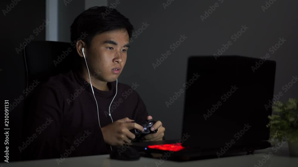 Poster stressed depressed young man using joystick to playing games