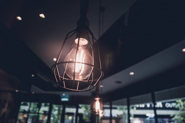 Fototapeta na wymiar retro light bulb in coffee shop interior view