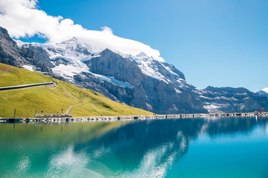 Fallbodensee lake and snowy mountain at Jungfrau region in Switzerland