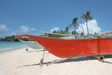 Obraz na płótnie Canvas Red Wooden Fishing Boat on Palawan Paradise Beach