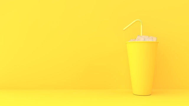 paper cup on yellow pastel background