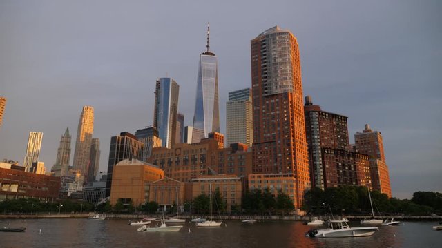 NEW YORK CITY - Circa June, 2018 - An evening exterior establishing shot of Manhattan apartment buildings with the Freedom Tower in the background. Day/Night matching available.  	