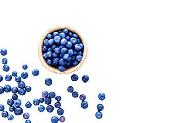 Fresh recently picked blueberries in bowl on white background top view copy space