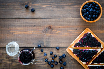 Bluberry toast for breakfast on dark wooden background top view space for text