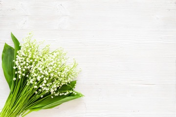 May flowers. Bouqet of lily of the valley flowers on white background top view copy space © 9dreamstudio