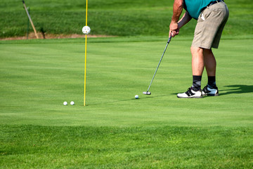 Obraz premium Golfer, golf player, on the green, mature male, not recognizable, copyspace