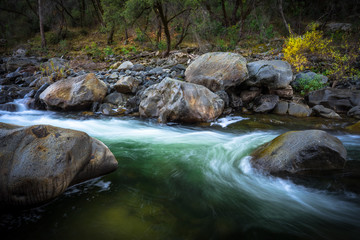 Naklejka na ściany i meble Swirling Emerald Pool in the Tuolomne River - California