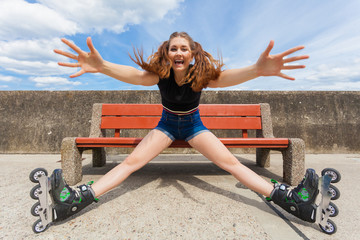 Joyful girl wearing roller skates