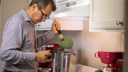 man cooking in the house inside the kitchen