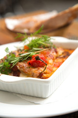 Delicious lasagna with fresh herbs on top