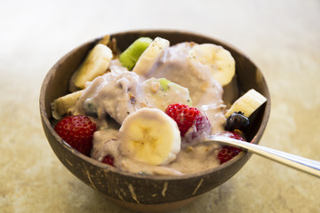 Blueberry smoothie bowl with banana, granola, strawberry
